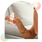 Woman holding Aspen Green Extra Citrus CBD oil bottle