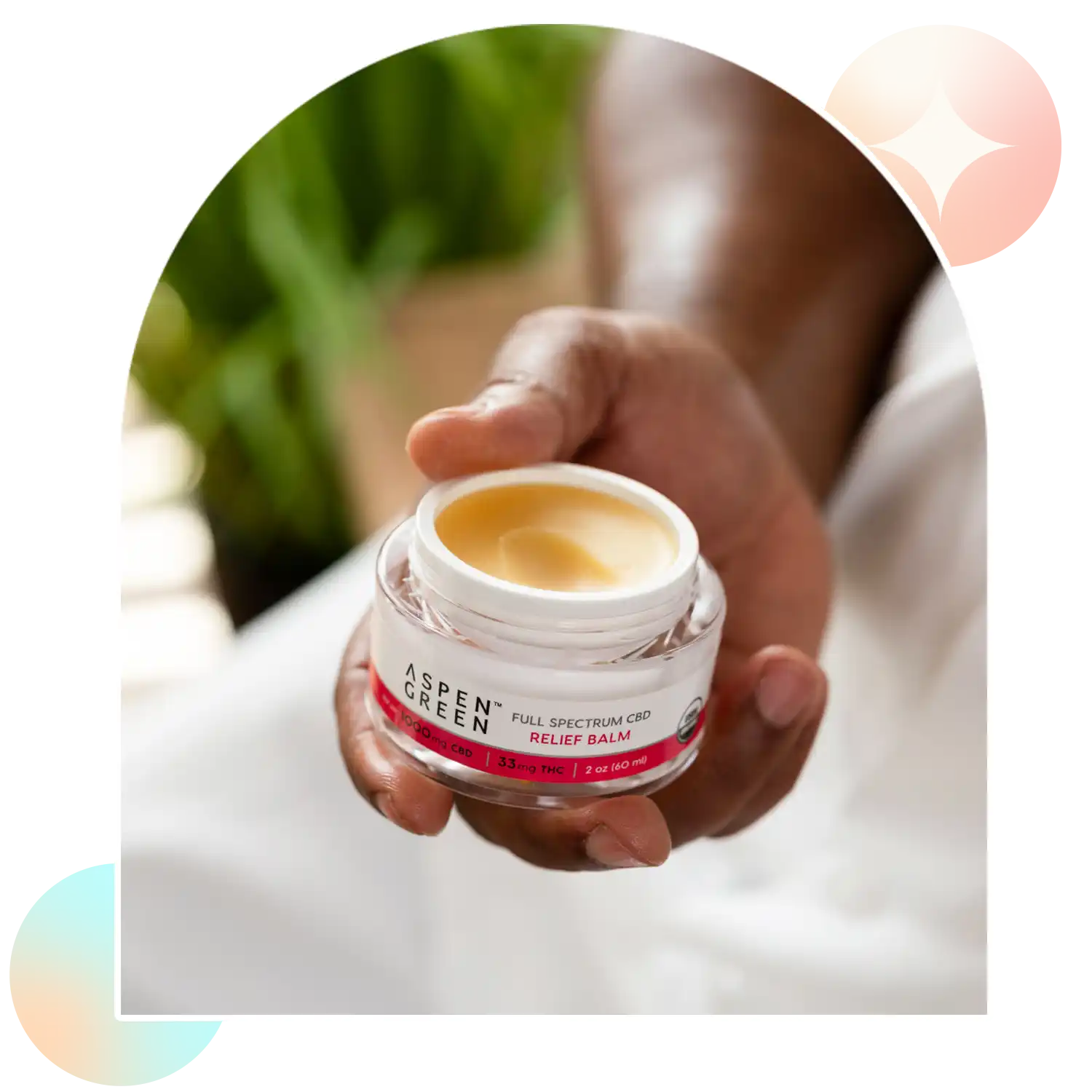 Open jar of Aspen Green Relief Balm