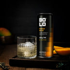 BOLO Mango Mojo THC drink can with glass of mango beverage with ice on wooden tray