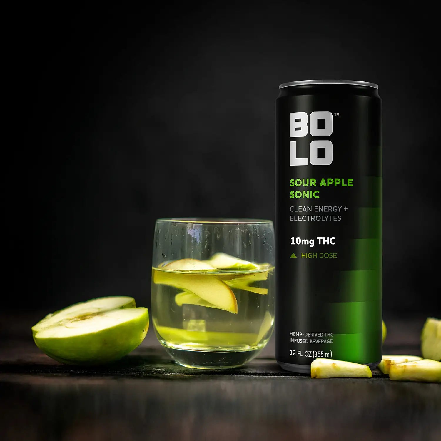 BOLO Sour Apple Sonic THC drink can with glass of sour apple beverage and fresh apple slices