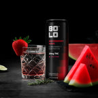 BOLO Waterberry Wave THC drink can with glass of strawberry + watermelon beverage and watermelon slices